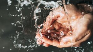 person washing hands | why to start double cleansing